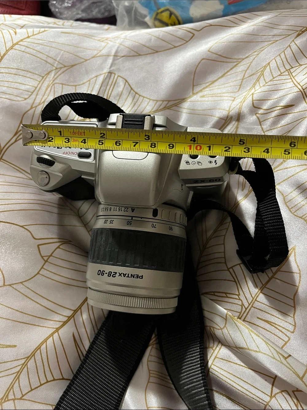Pentax Silver and Black DSLR with 28-90mm Zoom Lens and Branded Strap
